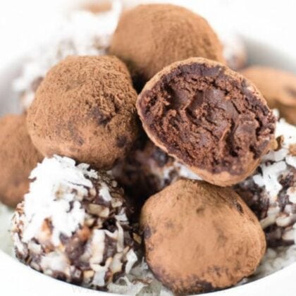 chocolate avocado truffles in white bowl.